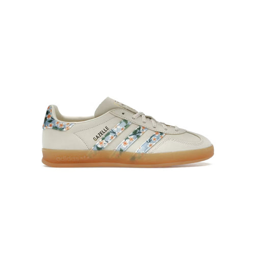 Beige sneaker with floral pattern on a white background