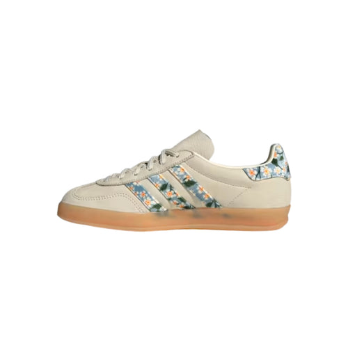 Beige sneaker with floral pattern on a white background