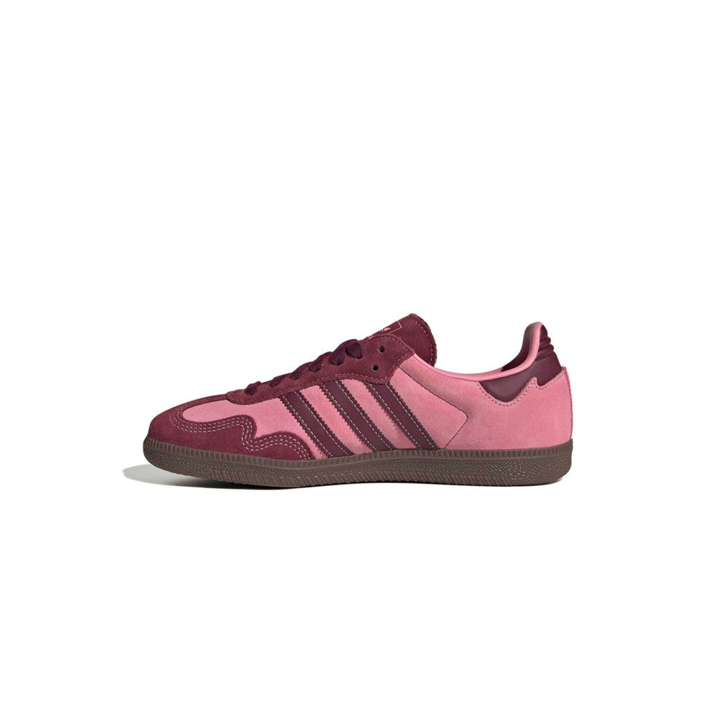 Pink and maroon Adidas sneaker on a white background