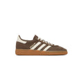 Brown sneaker with white stripes and 'Special' text on a white background