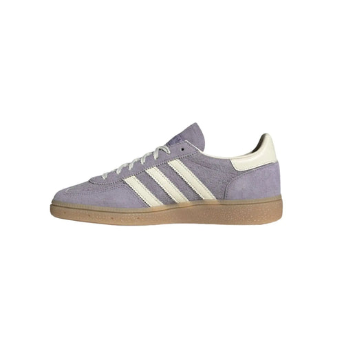 Gray Adidas sneaker with white stripes on a white background