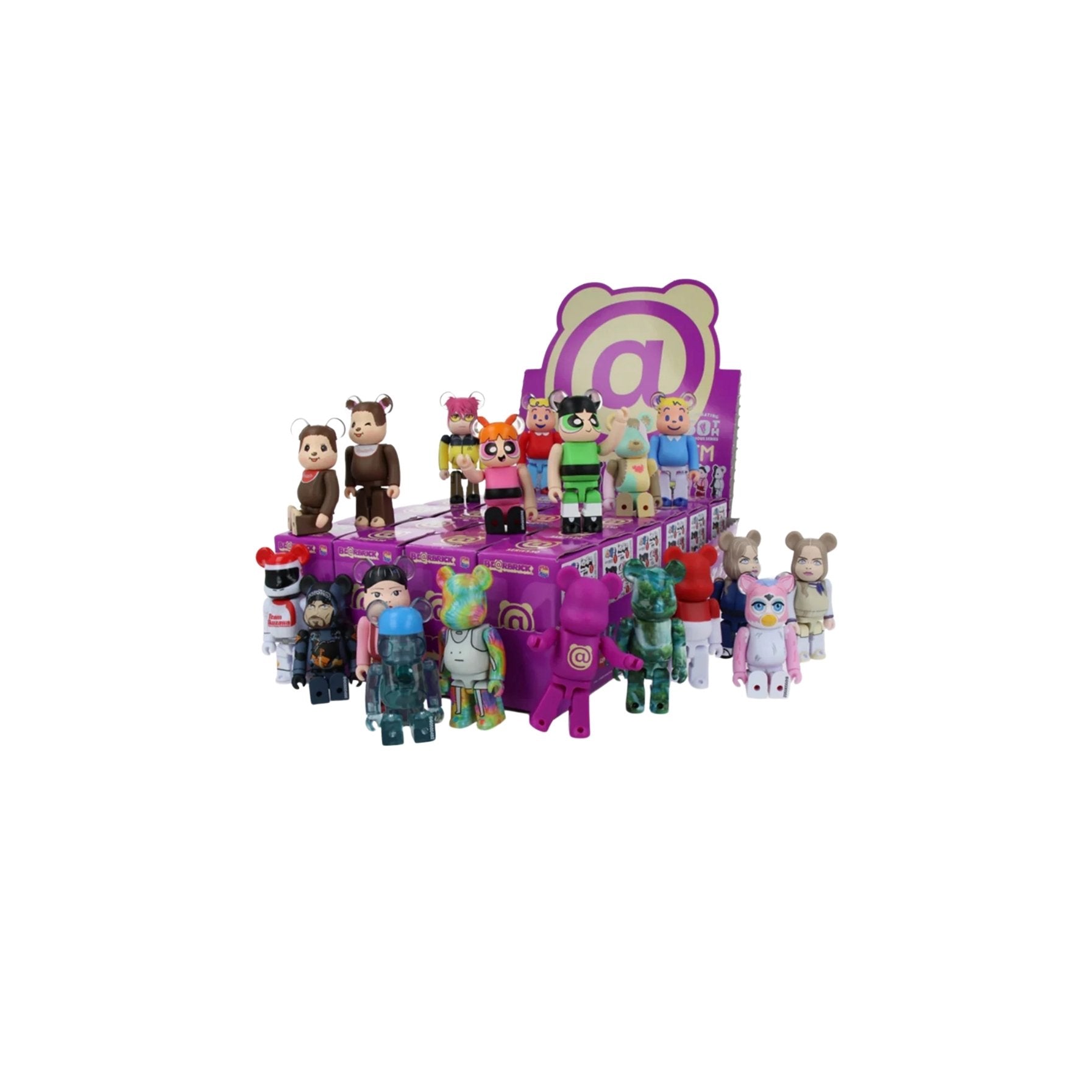 Collection of small figurines in front of a purple display stand with cartoon character design.