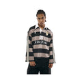 Person wearing a striped rugby shirt with visible branding on a white background