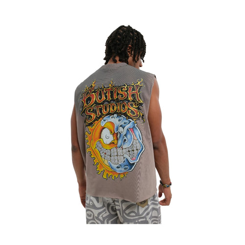 A man viewed from behind wearing a sleeveless gray vest with a large colorful graphic on the back that reads 'BUTCH STUDIOS,' paired with patterned shorts against a plain white background.