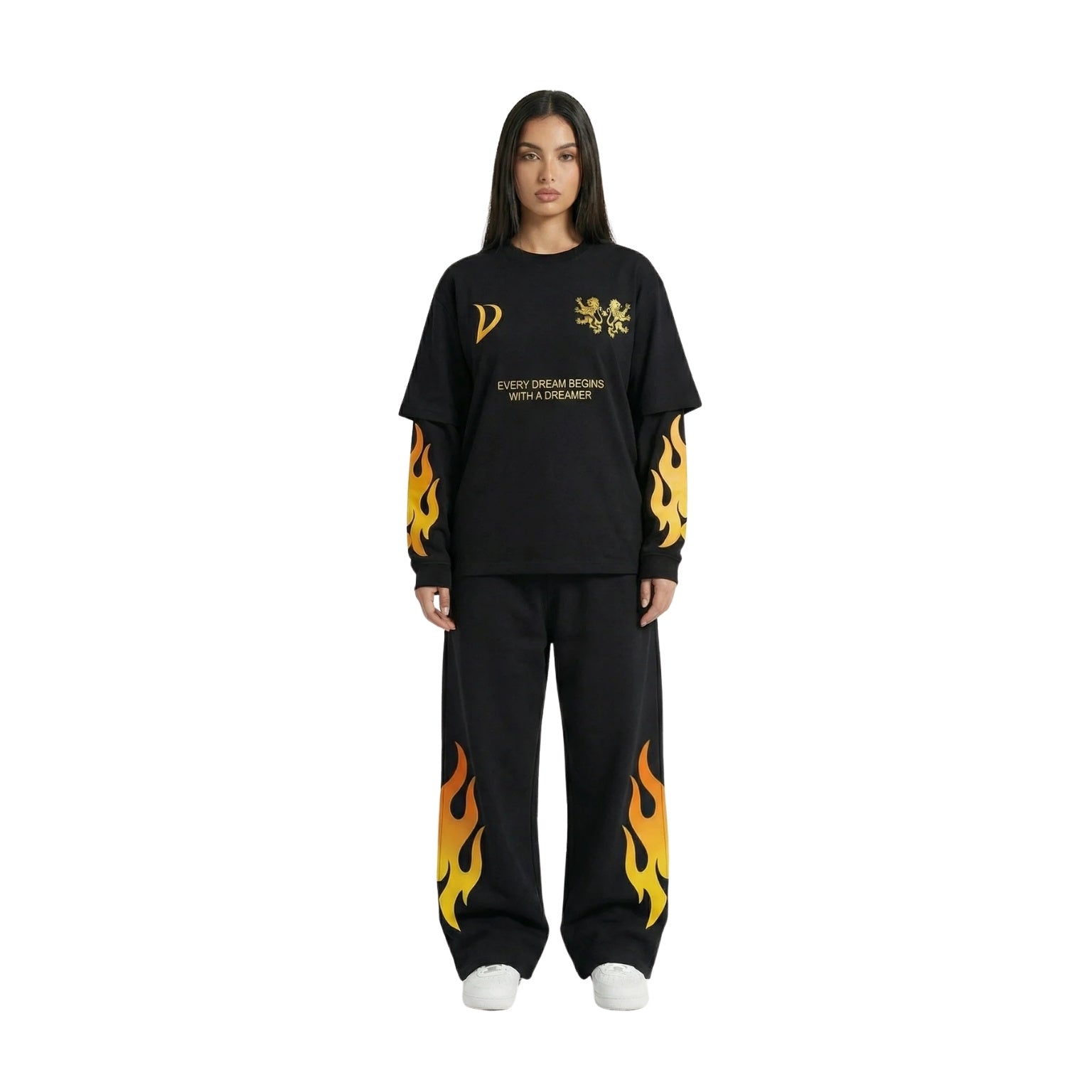 A model wearing a black two-piece lounge set featuring a long-sleeve t-shirt and matching sweatpants, both decorated with yellow and orange flame graphics and gold text on the chest, set against a plain white background.