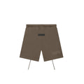 Brown shorts with a brand label on a white background