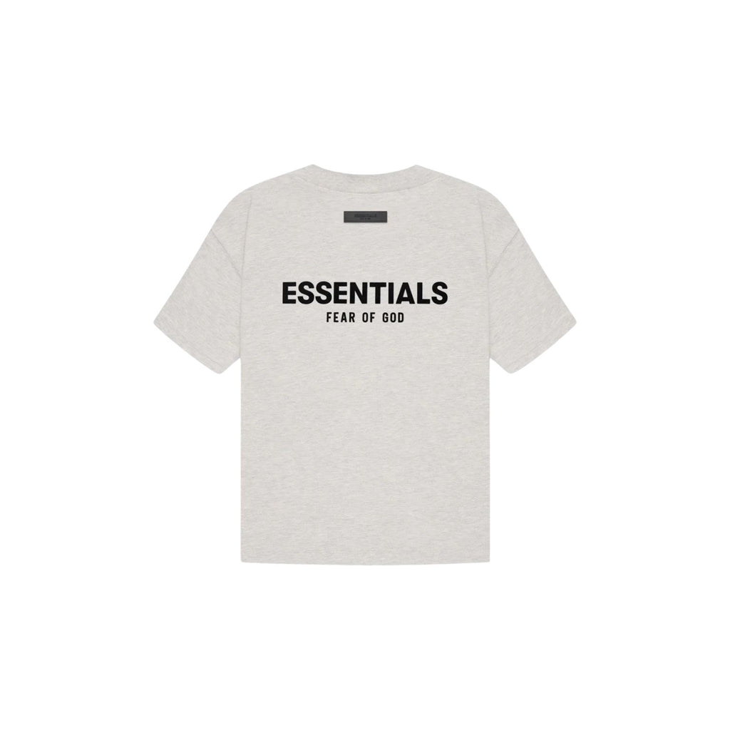 White t-shirt with 'ESSENTIALS FEAR OF GOD' text on a white background