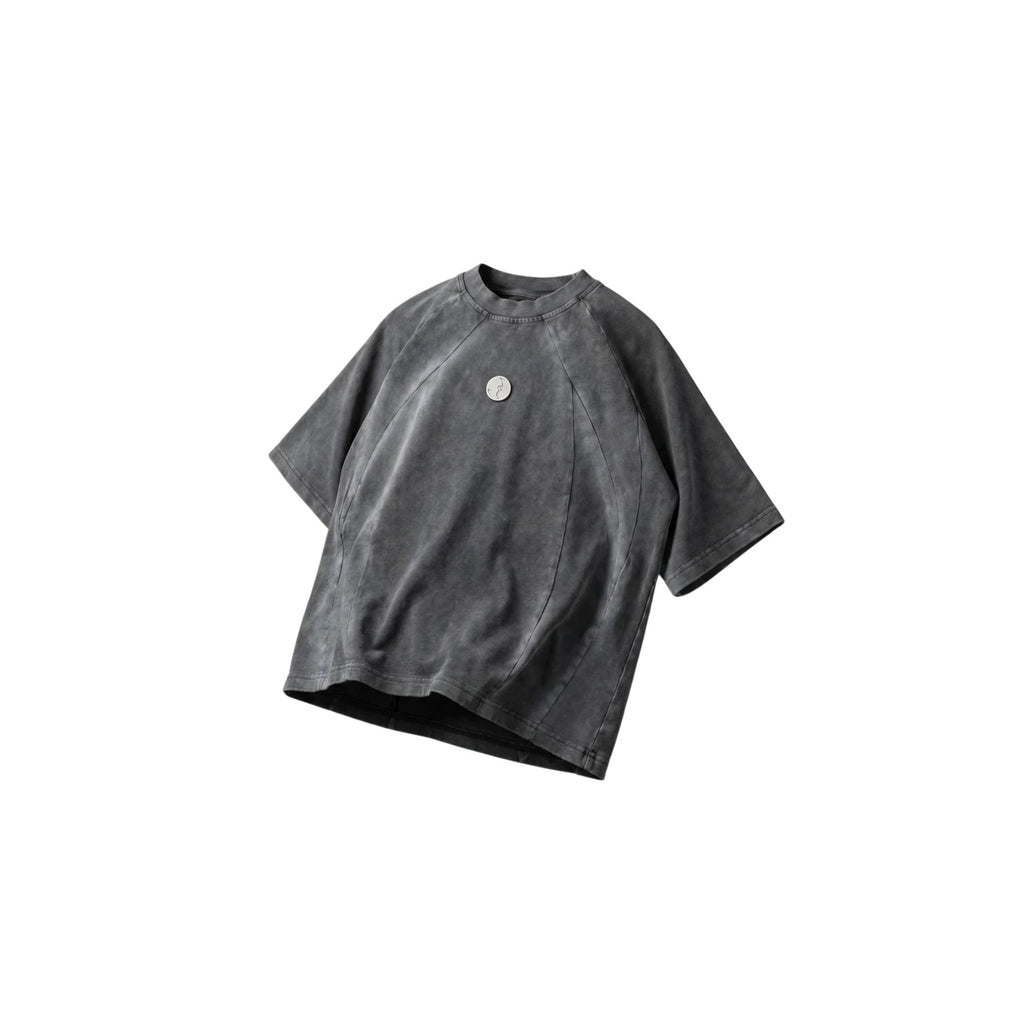 Gray t-shirt with a small logo on a white background
