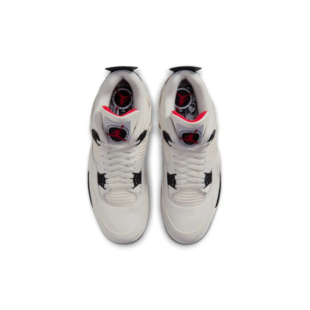 White sneakers with black and red accents on a white background