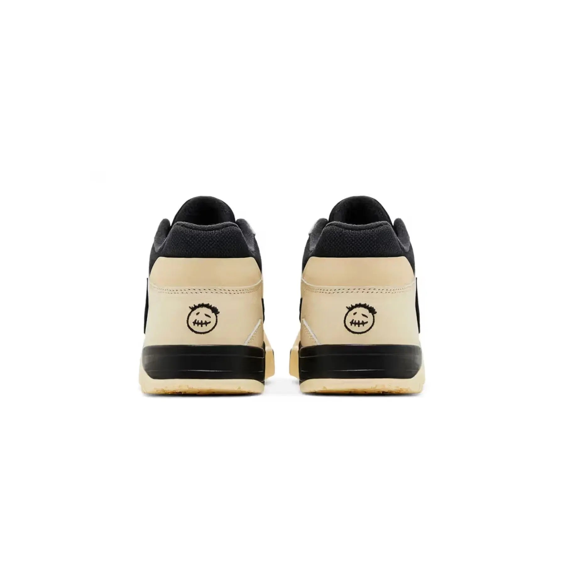 Pair of black and beige sneakers on a white background
