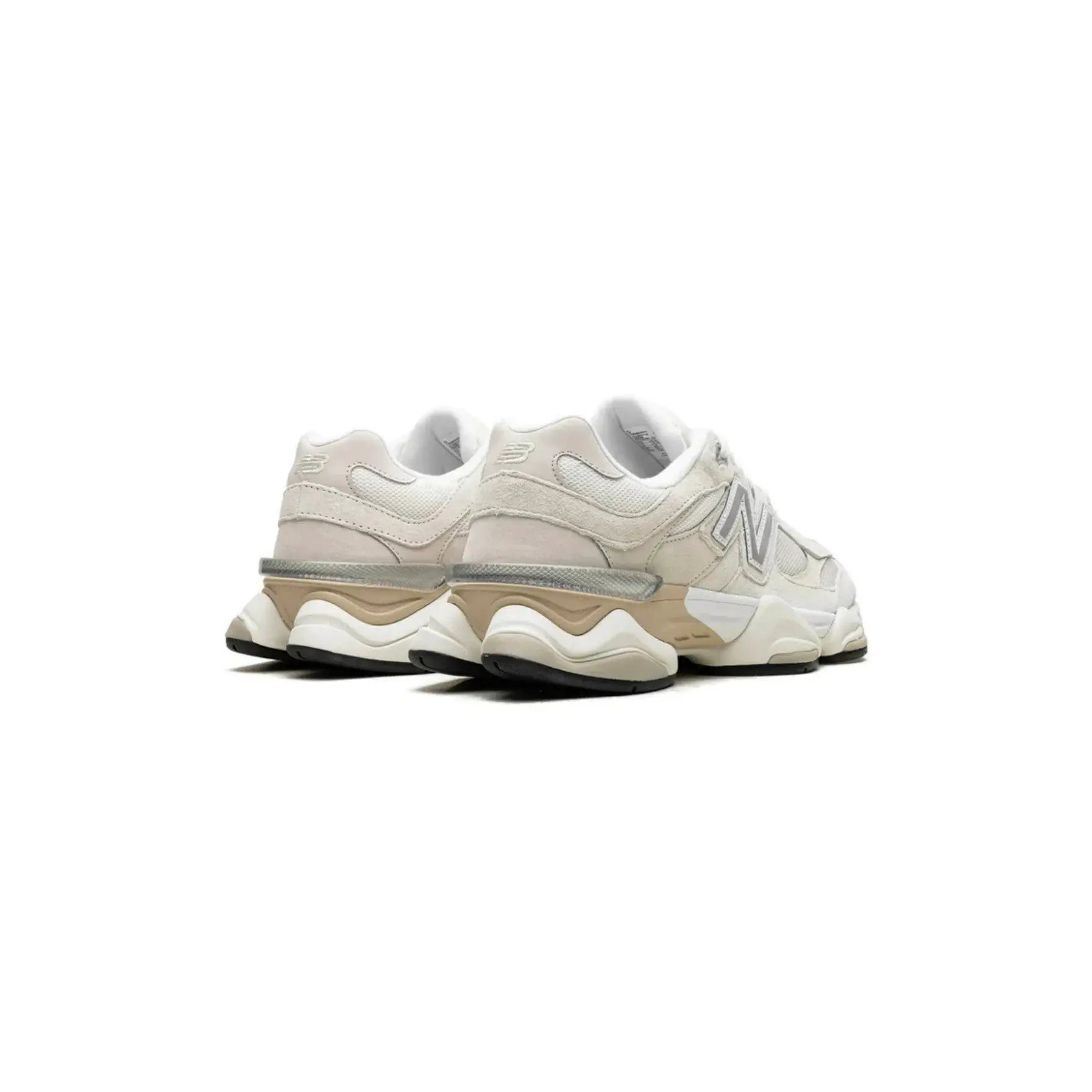 Pair of beige sneakers on a white background