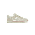 White sneaker with a red accent on a white background