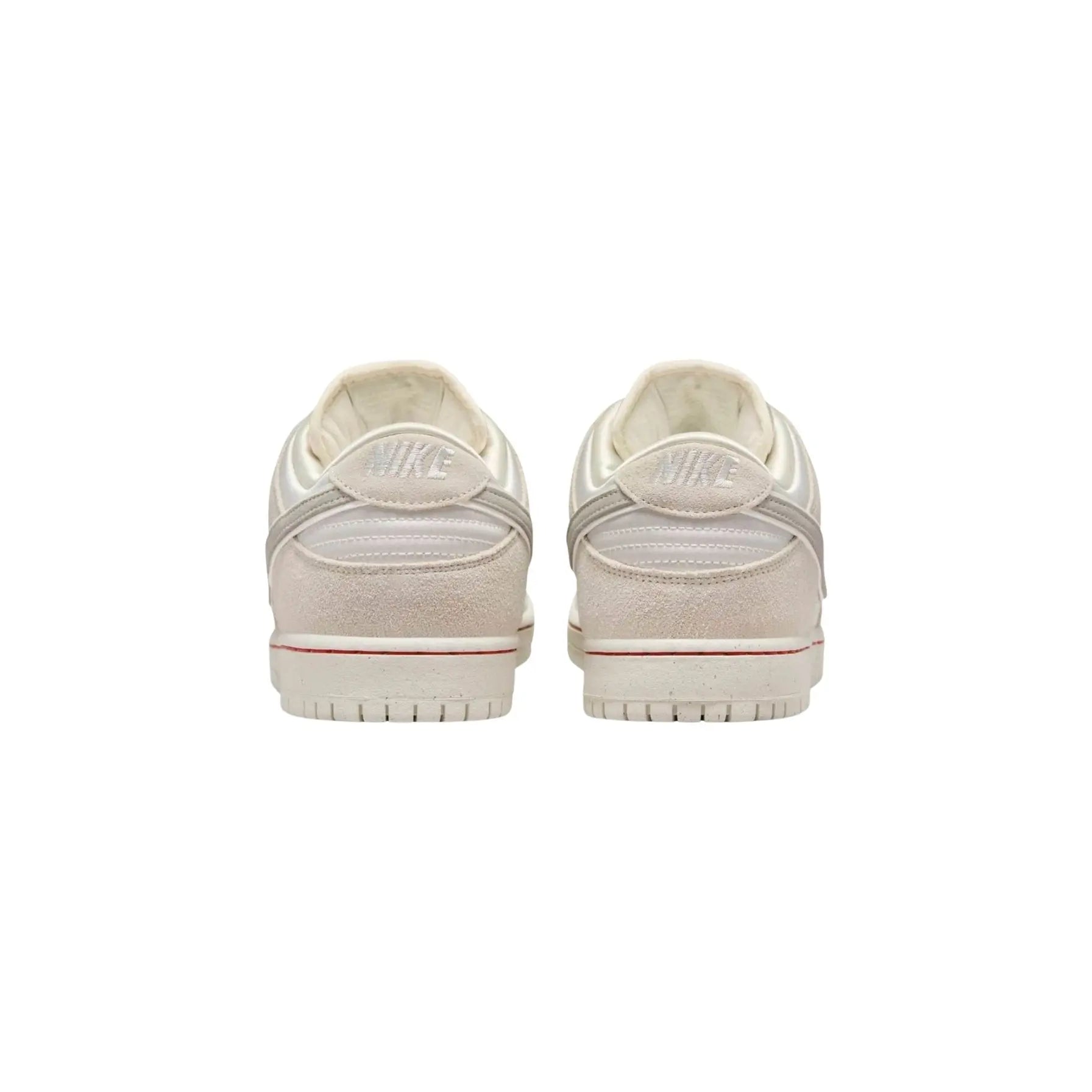 Pair of white sneakers on a white background