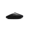 A single black Nike slide sandal shown from a side profile view against a solid white background.