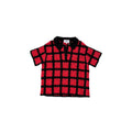 Black and red patterned shirt on a white background