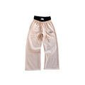Beige pants with a black waistband on a white background