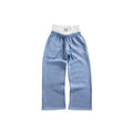 Light blue sweatpants with a logo on a white background