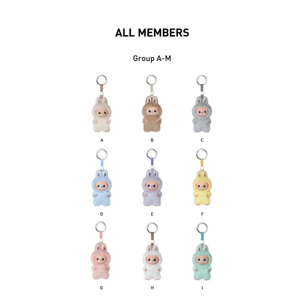 A product color options chart showing ten small bunny-shaped keychains labeled A through I, with the heading 'ALL MEMBERS' and 'Group A-M' on a white background.