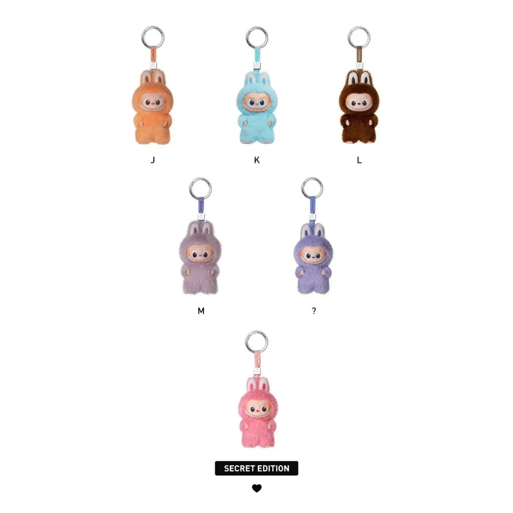 Five small bunny-shaped keychain charms in different colors are shown on a white background, labeled J, K, L, M, and ?, with a 'SECRET EDITION' label below.