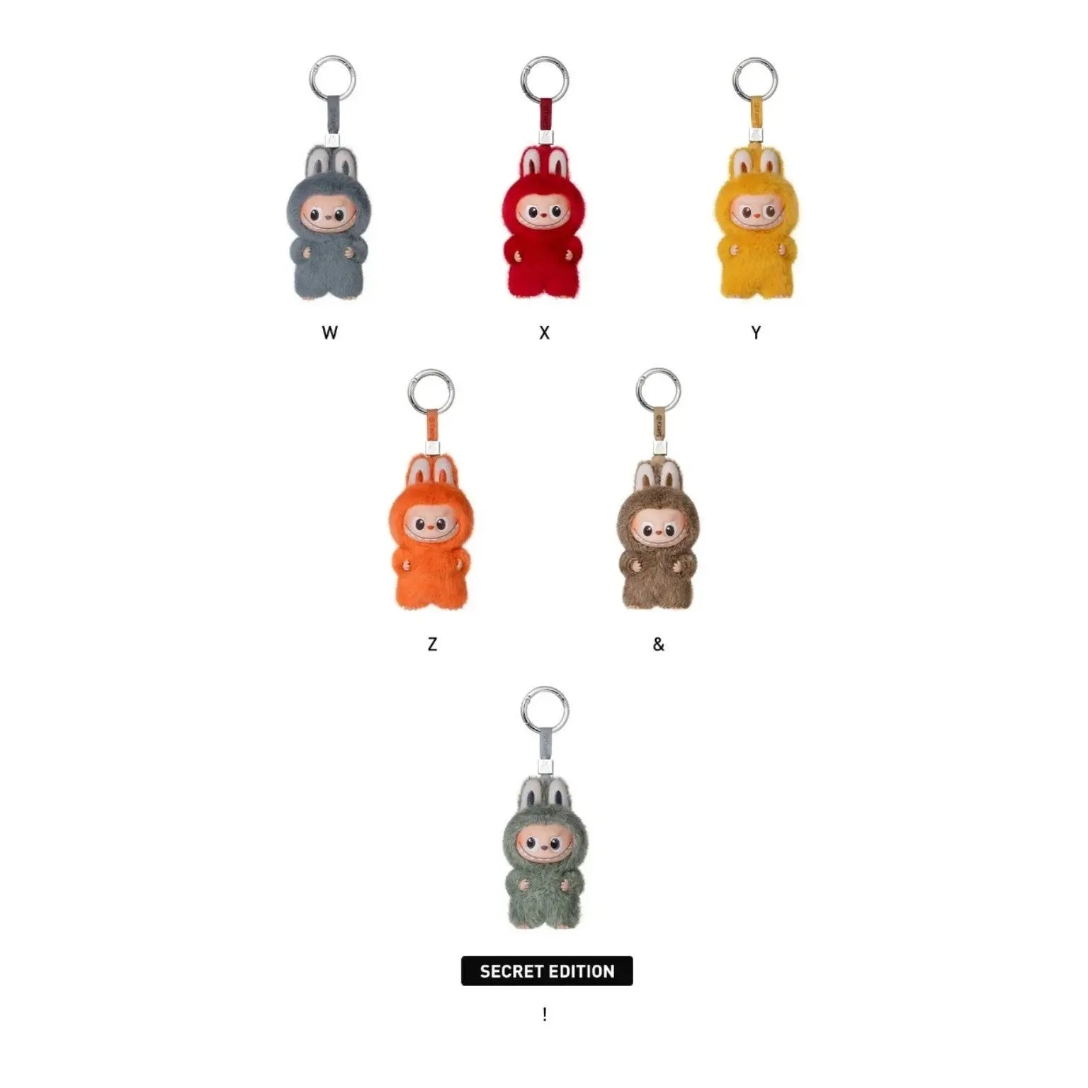 Five small character keychain charms in different colors are arranged on a white background, with labels W, X, Y, Z, & and a lower 'SECRET EDITION' label. The charms appear to be the product being shown, not an auxiliary color chart, because the actual physical items are depicted rather than just flat swatches.