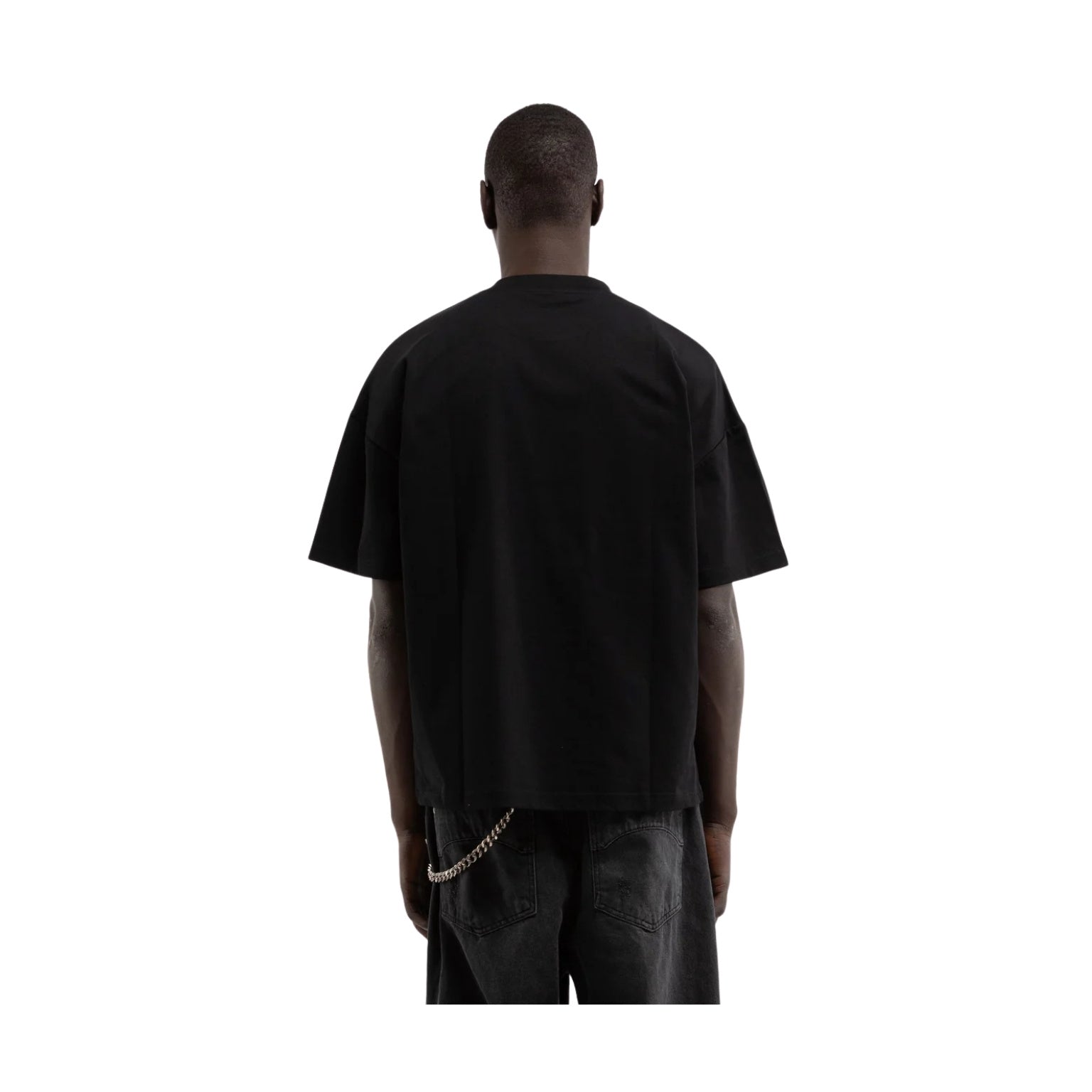 Person wearing a black t-shirt and pants on a white background