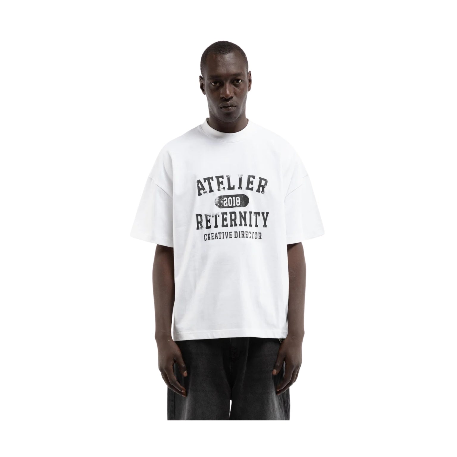 Person wearing a white t-shirt with text on a white background