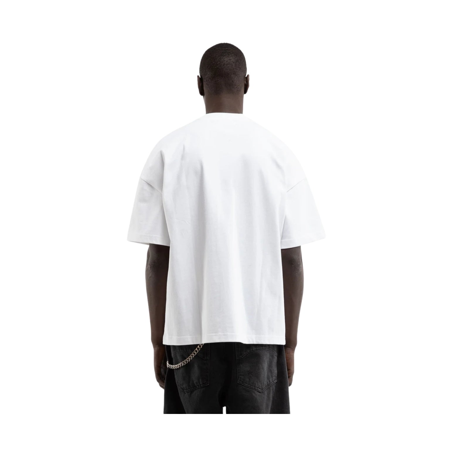 Person wearing a plain white t-shirt on a white background