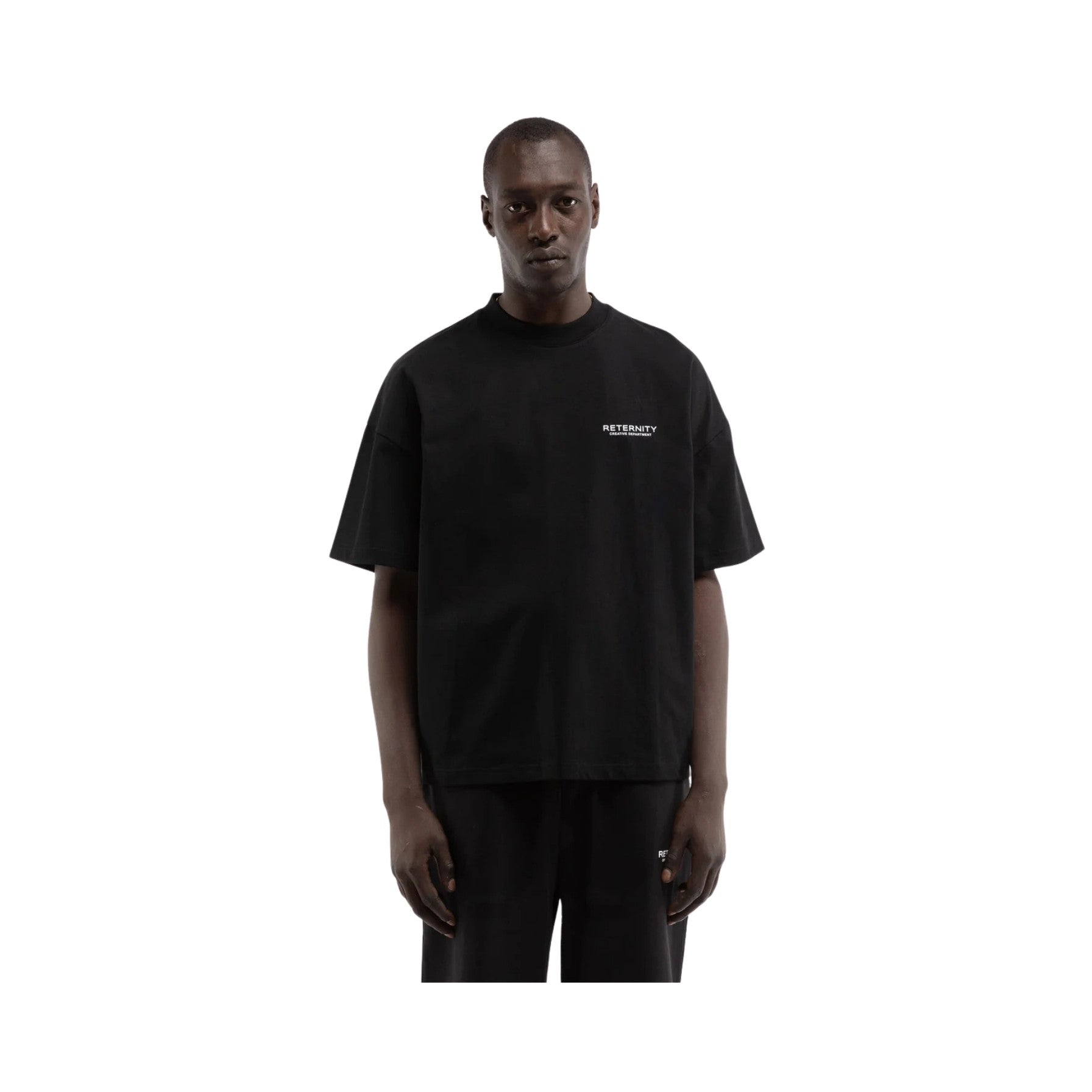 Person wearing a black t-shirt with a logo on a white background