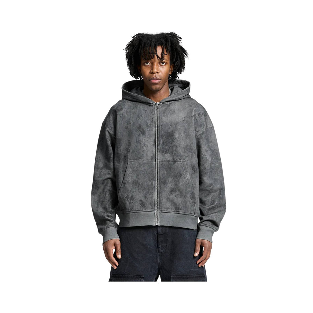Person wearing a gray hoodie on a white background