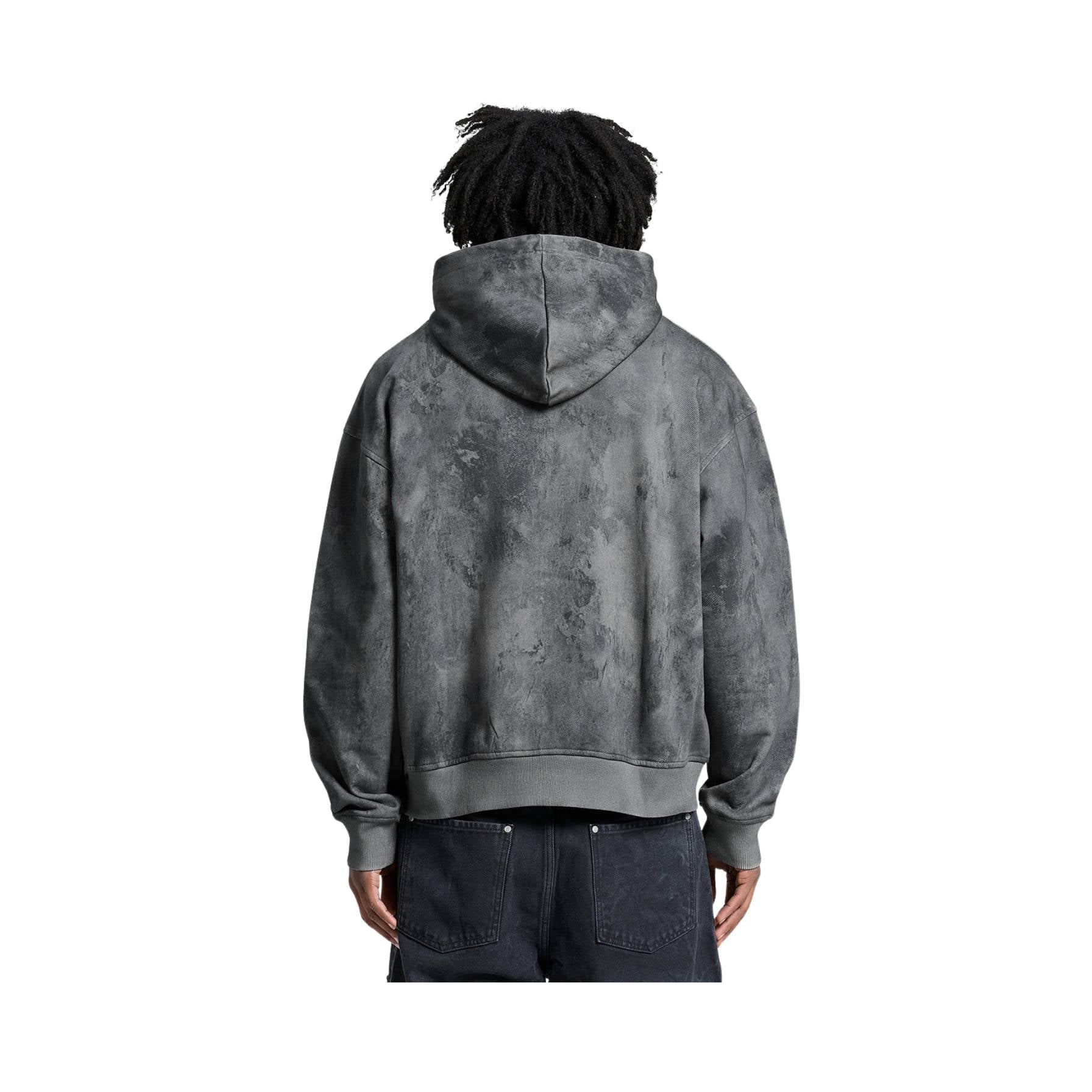 Person wearing a gray hoodie with a white background