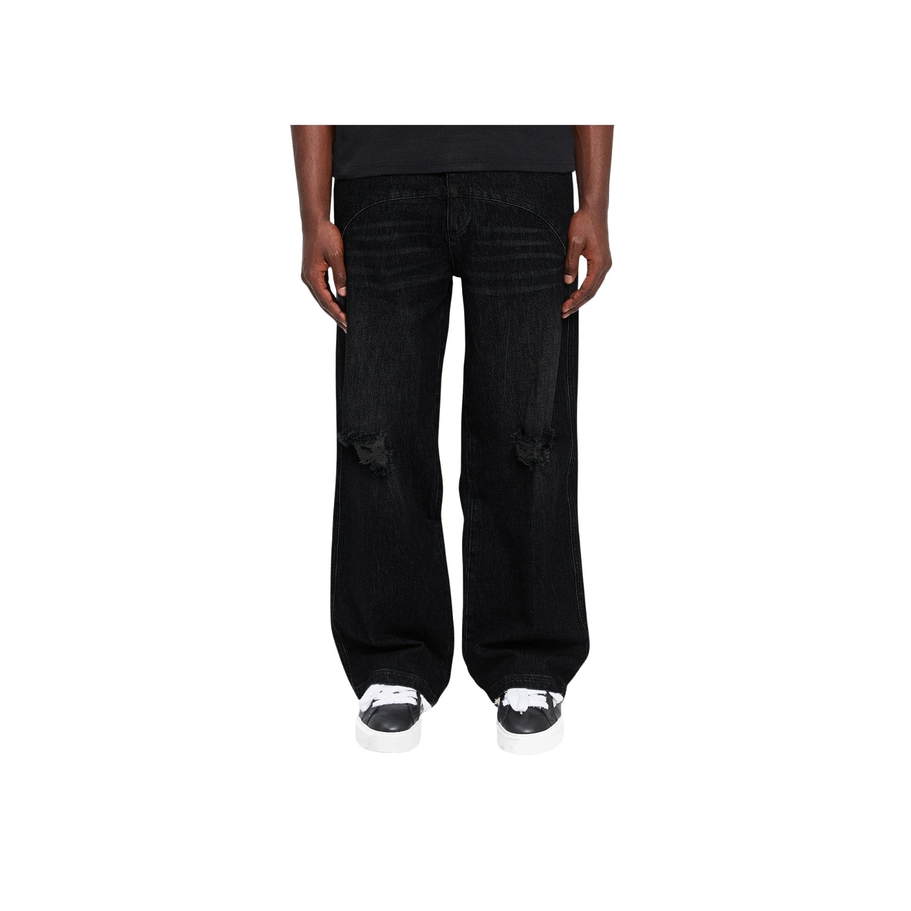 Black wide-leg jeans worn by a person on a white background