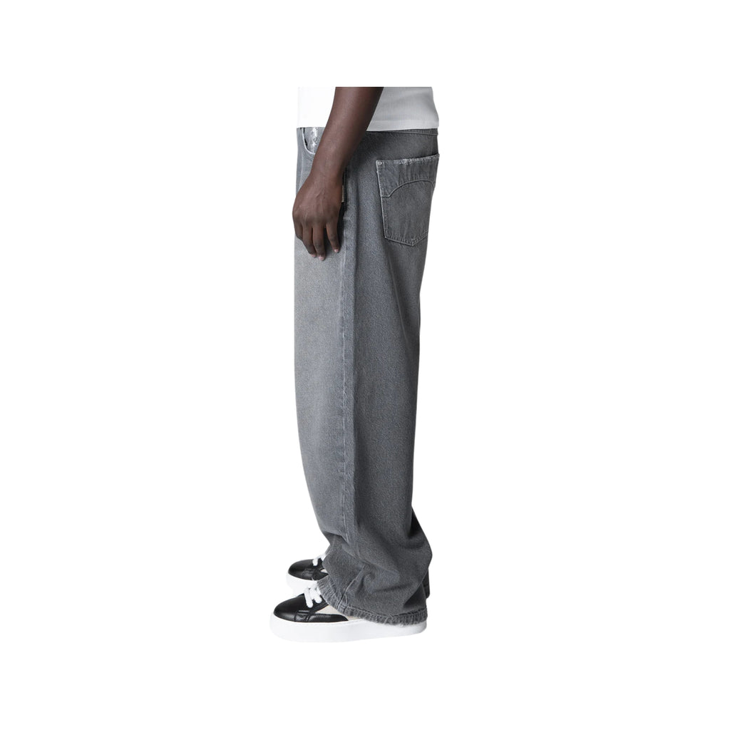Person wearing gray jeans on a white background