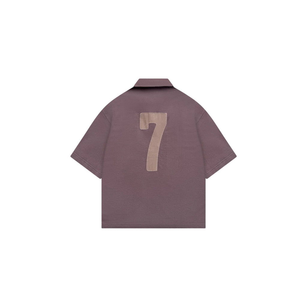 Brown shirt with number 7 on the back against a white background