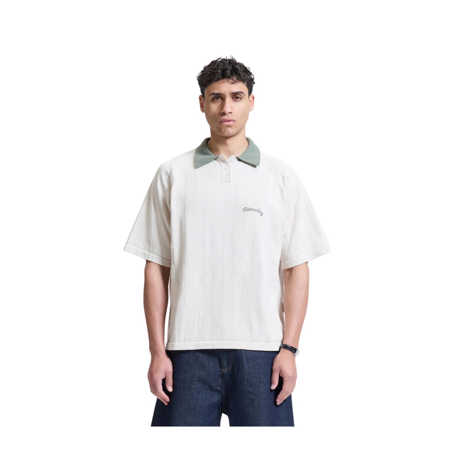 Man wearing a white polo shirt with green collar on a white background