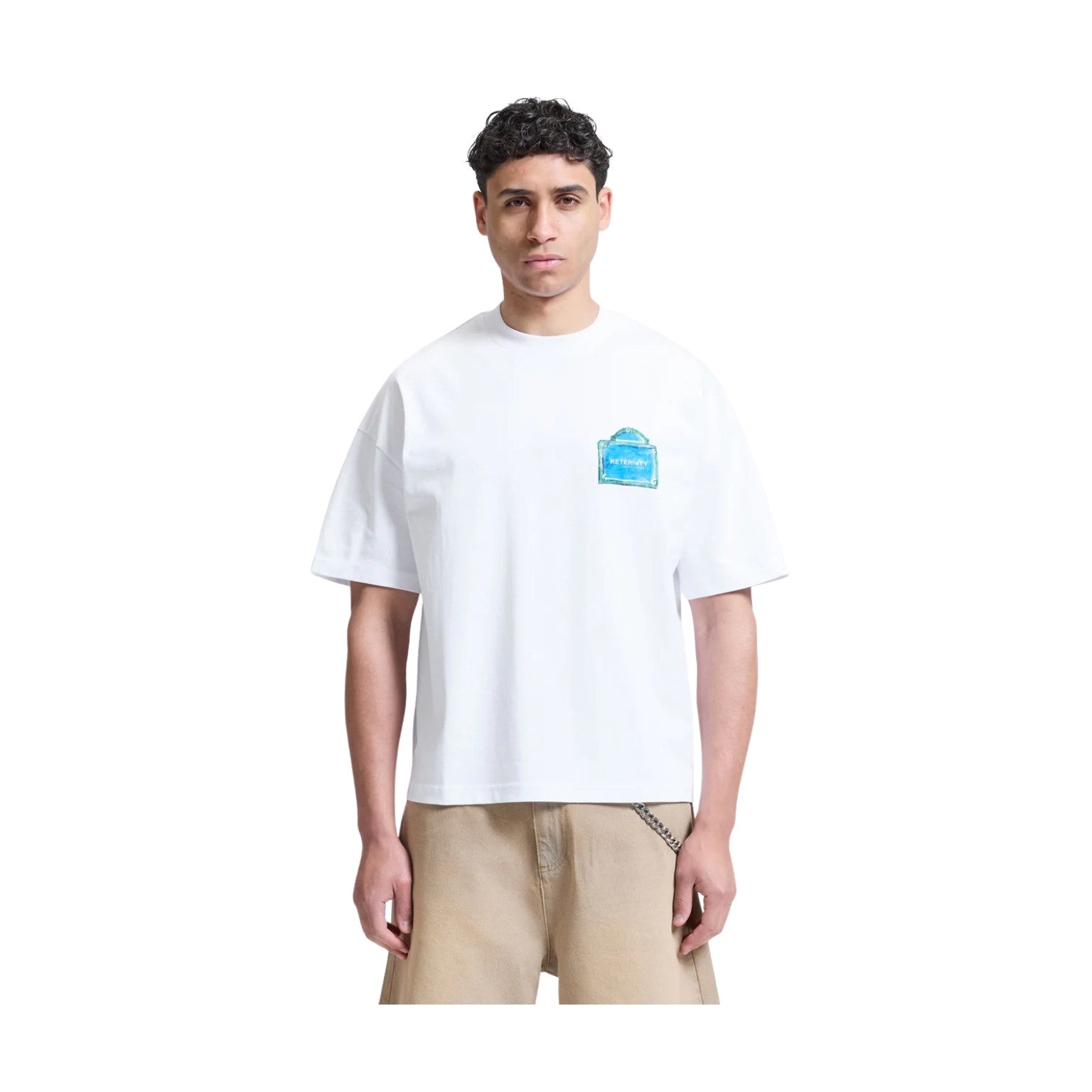 Person wearing a white t-shirt with a blue logo on a white background