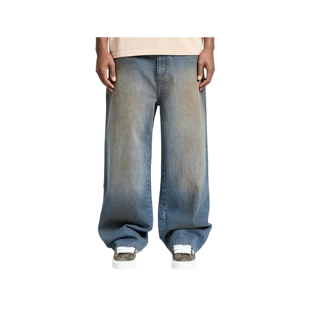 Person wearing a pair of blue jeans on a white background