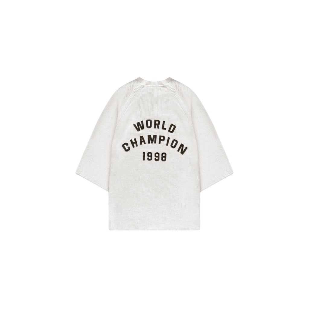 White t-shirt with 'World Champion 1998' text on a white background