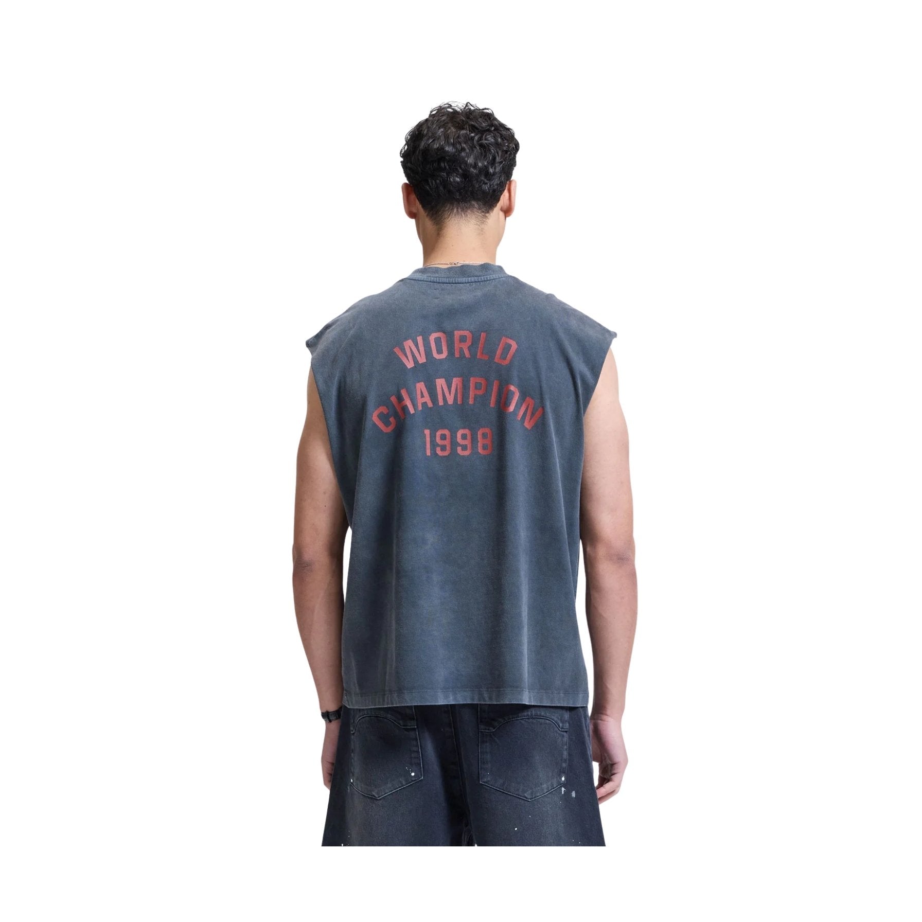 Person wearing a sleeveless shirt with 'World Champion 1998' text on the back, on a white background