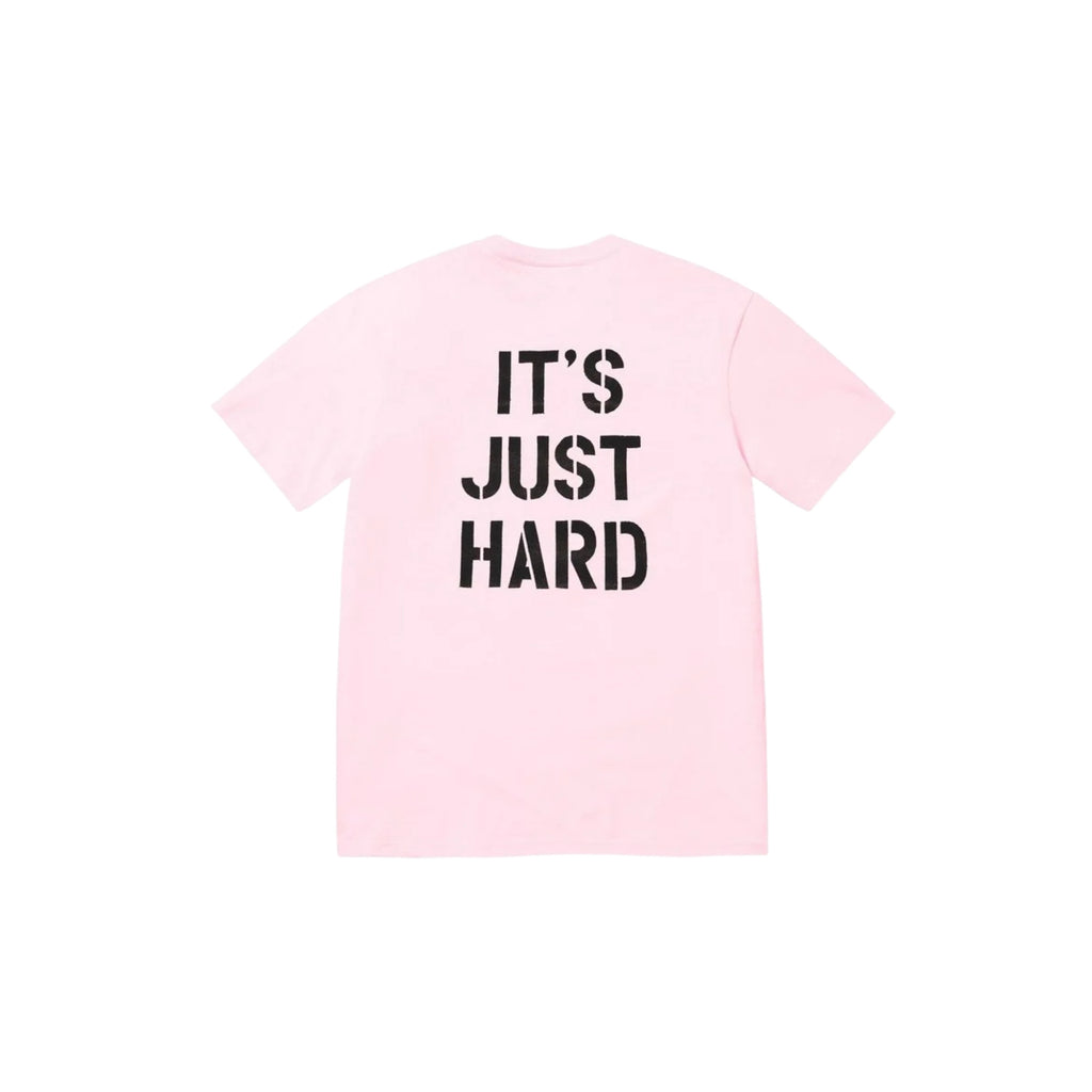 Pink t-shirt with 'IT'S JUST HARD' text on a white background