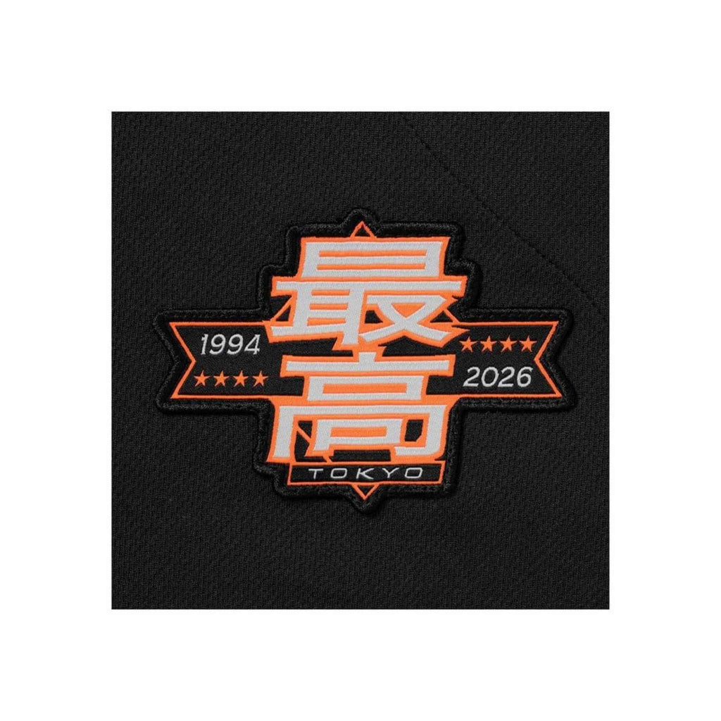 Black patch with orange text and design on a white background