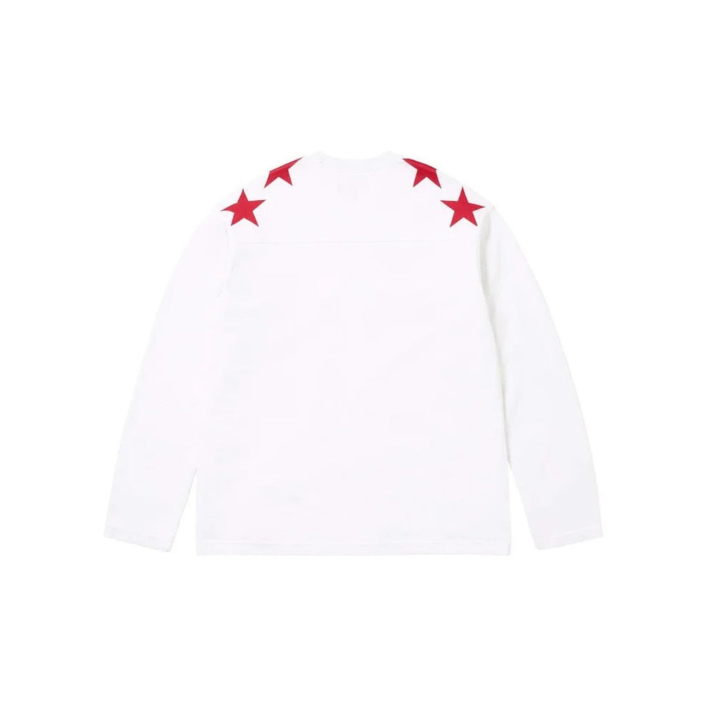 White long-sleeve shirt with red star designs on a white background