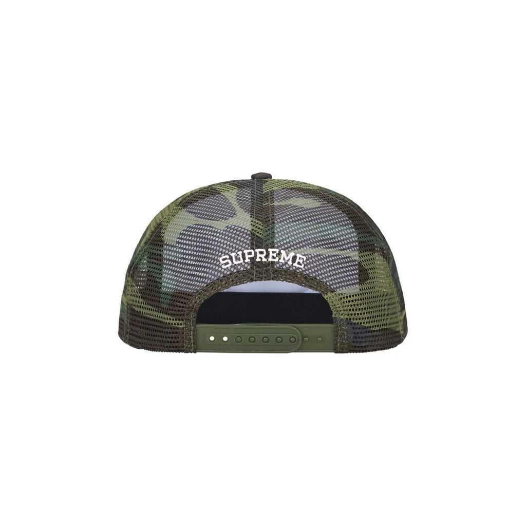 Green camouflage cap with 'Supreme' logo on a white background