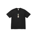 A black short-sleeve crewneck t-shirt with a small vertical graphic print on the center chest, displayed flat against a solid white background.